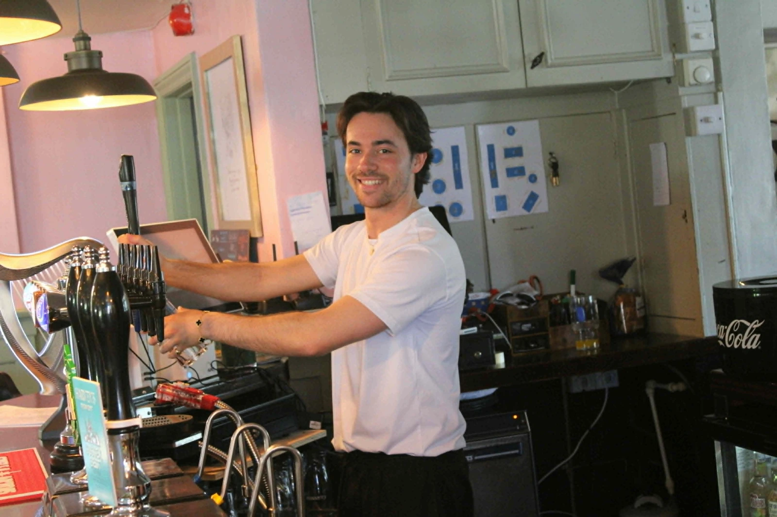 Bartender pouring a pint at The Alexandra Arms