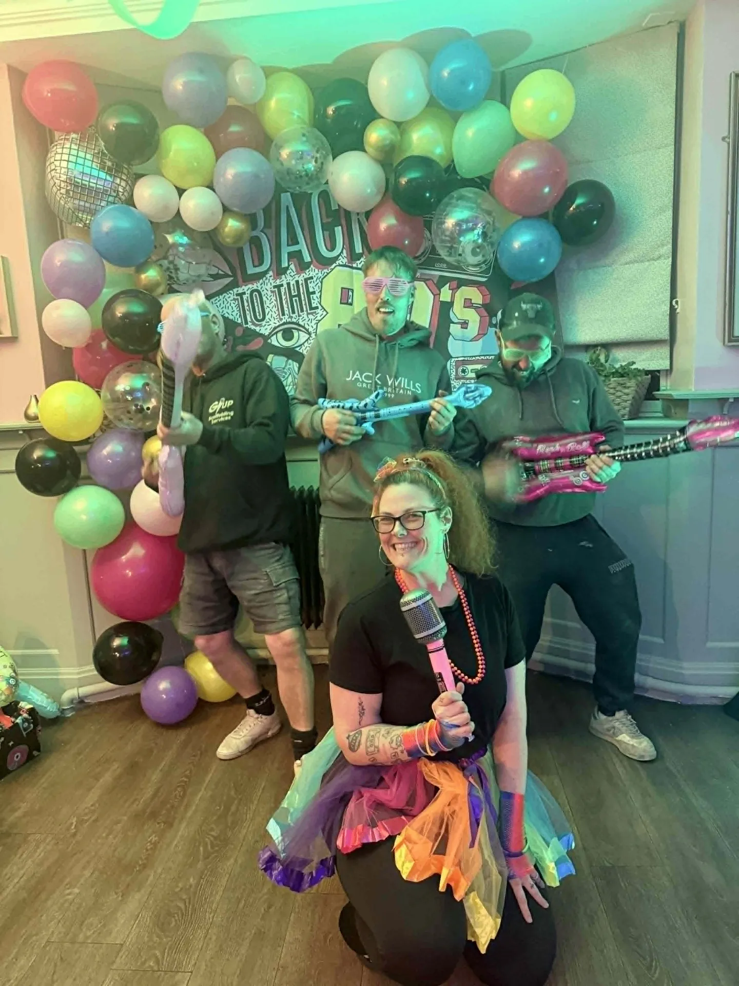 Friends celebrating a private 80s-themed party at The Alexandra Arms